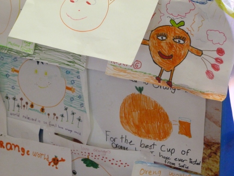 Kids' drawings of oranges are plastered all over the shop